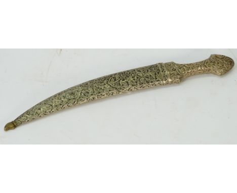 An Ottoman Turkish jambiya, mid-19th century, the hilt and scabbard encased in white metal with foliated chased decoration, t