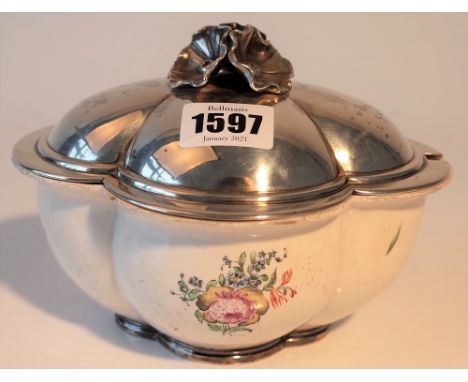 A French silver lidded Chantilly ceramic sauce tureen and cover, of quatrefoil shaped form, the base decorated with floral sp