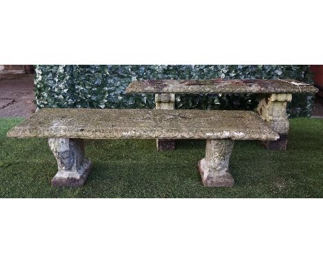 A reconstituted stone rectangular garden bench on scroll trestle end standards, 130cm wide together with another similar, als