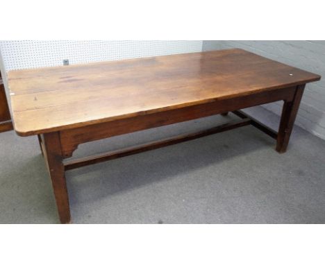 A 19th century oak kitchen table, the rectangular plank top on square supports, united by a stretcher, 103cm wide x 230cm lon