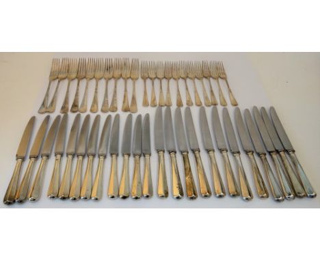 A silver rat tail pattern part table service, comprising; eleven table forks, four serving spoons, twelve dessert forks, one 