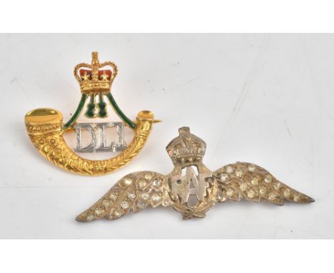 A 9ct two colour gold, green and red enamelled military brooch, designed as the badge of The Durham Light Infantry, Birmingha