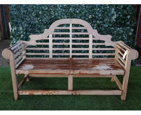 A Lutyens design teak framed hardwood garden bench, 165cm wide x 104cm high. 
