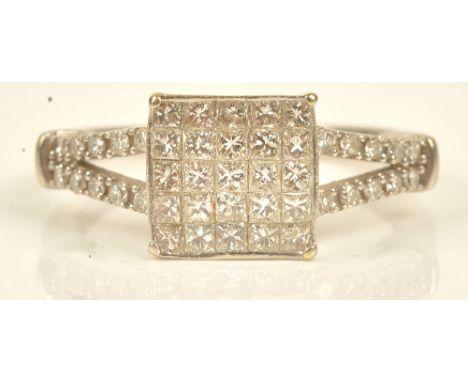 A diamond set square cluster ring, mounted with princess cut diamonds, between circular cut diamond set split shoulders, ring