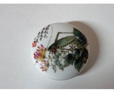 A small Chinese circular shallow box and cover, painted with a grasshopper amongst flowers beside calligraphy and a red seal,