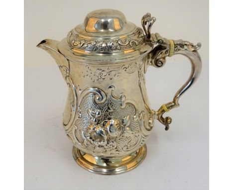 A Victorian silver pear shaped jug, Robert Hennell, London 1866, adapted from a mug, with additional marks for William Hutton