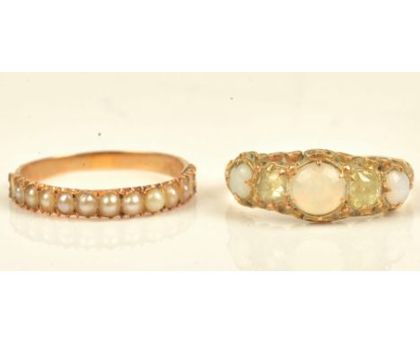 A Victorian gold ring, set with a row of seed pearls (three seed pearls lacking), ring size L and a Victorian 15ct gold, opal