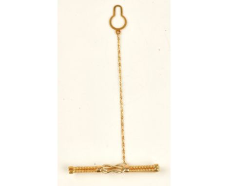 A gold tie slide in a ropetwist and knot design, detailed 750 CARNIANI, with a safety chain, weight 6.6 gms, with a case.