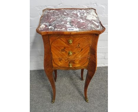 A late 19th century French gilt metal mounted marquetry inlaid, kingwood marble top bombe two drawer side table, on slender c