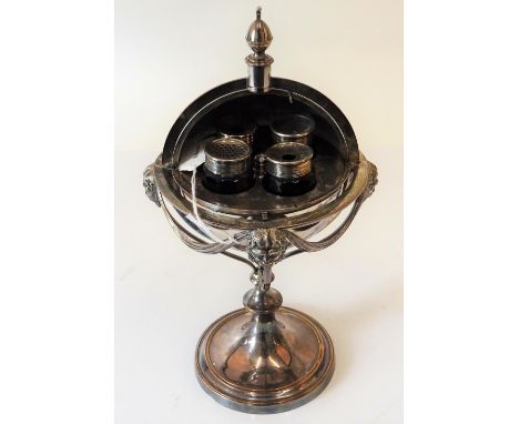 A silver plated on copper ink stand, of sprung spherical form, opening to reveal four silver plated metal mounted blue glass 
