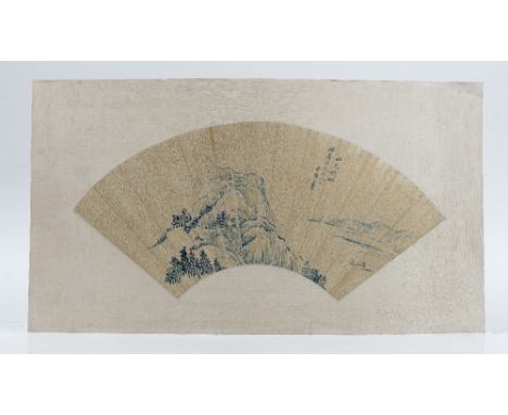 A Chinese fan painting, painted in blue monochrome on paper with a mountainous landscape against a gold flecked ground, signe