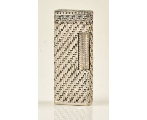 A white gold cased and diamond set rectangular gas lighter, the exterior decorated with textured stripes and mounted with a b