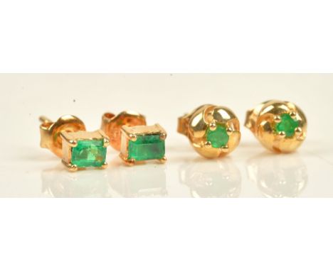 A pair of gold and emerald single stone ear studs, each claw set with a cut cornered rectangular step cut emerald, the backs 