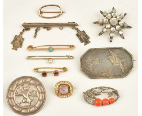 A moonstone brooch, designed as a starburst, a circular brooch with a Scottish lion motif, a gold and turquoise single stone 