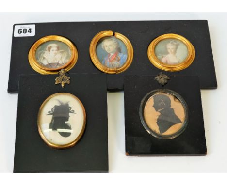 Three 18th/19th century portrait miniatures on ivory, framed as one, depicting Mary, Queen of Scots, King Louis XV of France 