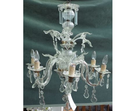 A 20th century Italian style glass six light chandelier with spiral column and moulded branches over two tiers, hung with cut
