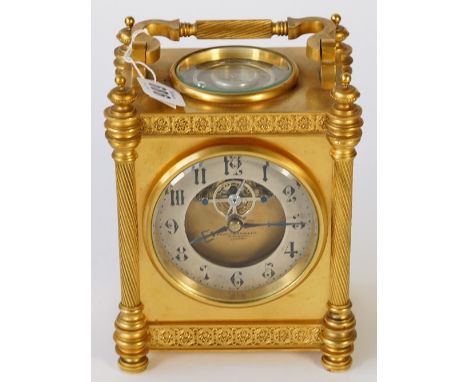 A French gilt brass carriage clock, the dial with silvered chapter ring and visible escapement detailed 'Howell &amp; James L