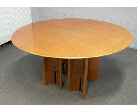 Gianna Offredo, made by Saporiti Italia; a circular birdseye maple centre table on four semi elliptic supports, bolts lacking