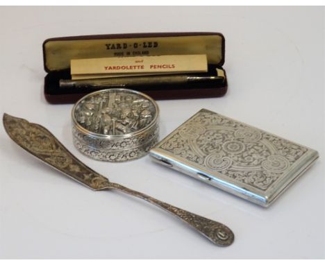 A circular box and cover, decorated with a tavern scene, probably European, a Victorian silver rectangular case with engraved