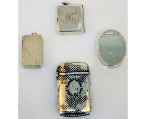 A George III silver oval hinge lidded box, the exterior plain, probably London 1801, a silver rectangular postage stamps case