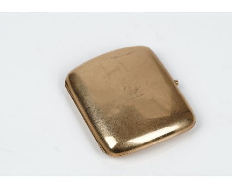 A 9ct gold curved rectangular cigarette case, engraved within and crest engraved to the front, (the hallmark rubbed), gross w