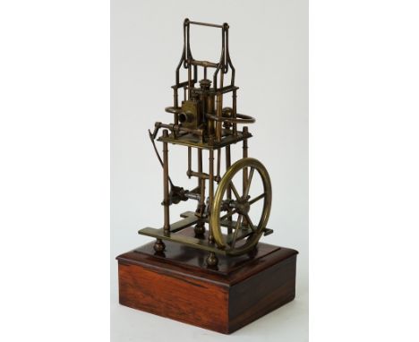 A brass model of a four pillar table engine, 20th century, the single vertical cylinder with valve chest, the crankshaft is s