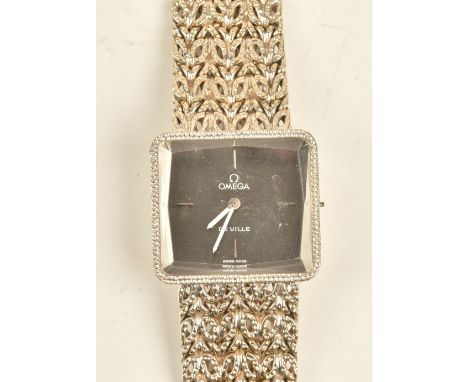 An Omega De Ville white gold rectangular cased ladies bracelet wristwatch, with a signed circular jewelled movement, the sign