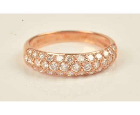 A gold and diamond set half hoop eternity ring, mounted with three rows of circular cut diamonds, detailed 750 18 K, ring siz