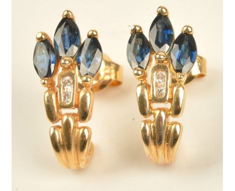 A pair of gold, sapphire and diamond earrings, each mounted with three marquise shaped sapphires and with two circular cut di