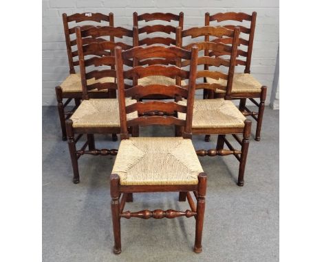 A set of six Lancashire ladder back rush seated dining chairs on turned supports, 47cm wide x 99cm high, (6). 