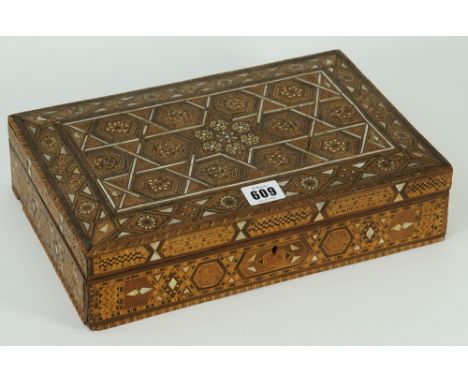 A Syrian rectangular wooden parquetry bone and mother-of-pearl box, the hinged cover and sides with geometric pattern, 32 x 2