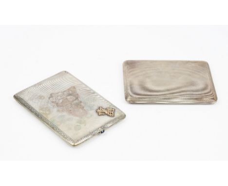 A silver rectangular slide action cigarette case, the exterior with engine turned decoration, London 1934, gross weight 187gm