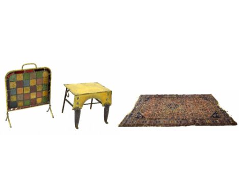 Small brass fire screen with stained glass tiles, 24" high; together with a brass fire footman and an antique rug on an orang