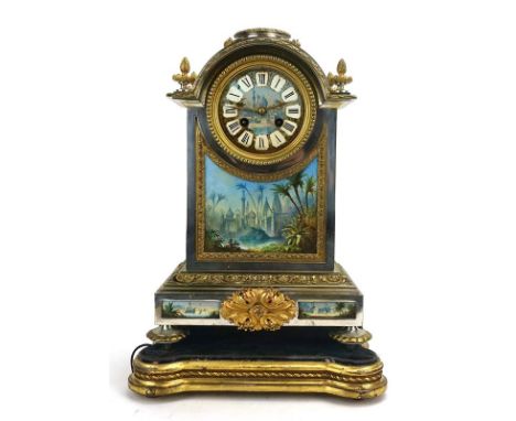 A late 19th century-style mantle clock, with a French movement in a silvered and gilt metal architectural case surmounted by 