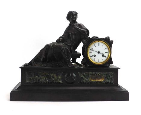 A 19th century French mantle clock, the movement striking on a bell, the enamelled face with Roman numerals, within a spelter