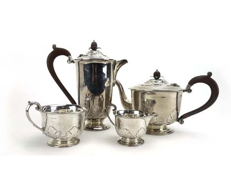 An early 20th century silver four piece tea service of slender vase shaped form having applied acanthus leaf decoration and p