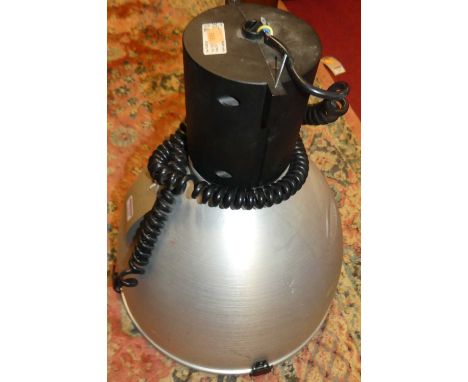 A contemporary domed brushed aluminium industrial hanging ceiling light, with cord flex