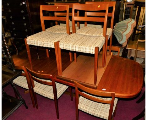Svend Madsen - a 1960s Danish teak dining suite, comprising; extending dining table with rounded D-ends, having pull-out acti