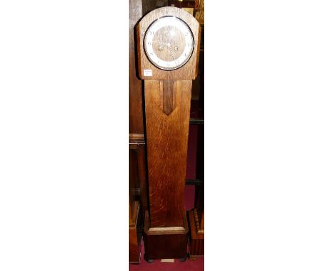 An Art Deco oak grand-daughter clock, having silvered chapter ring, twin winding holes with rod pendulum, height 140cm