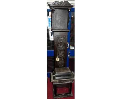 An early 20th century relief carved oak longcase clock case only; together with an 18th century provincial oak longcase hood 