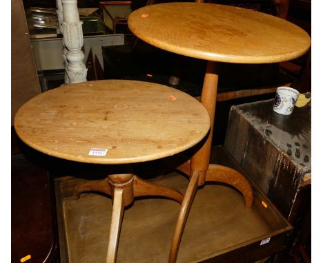 A light oak fixed top circular pedestal tripod occasional table, dia.40cm; together with a smaller oval low pine example (2)
