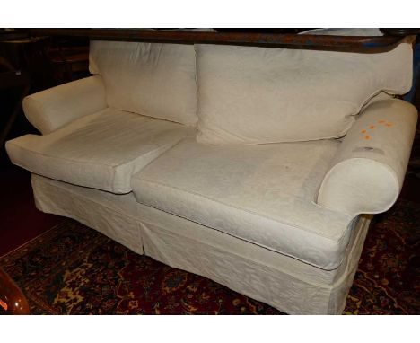 A contemporary white floral upholstered three-seater sofa, width 205cm