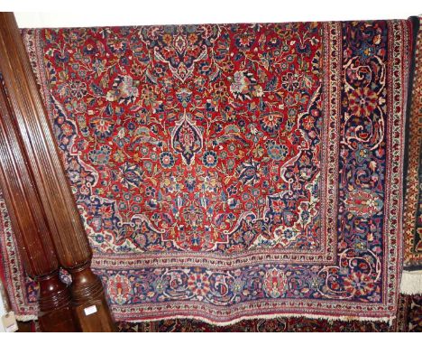 A Persian woollen red ground Tabriz rug, 195 x 132cmCondition report: Colour is good.Some fraying to edges and light marks on