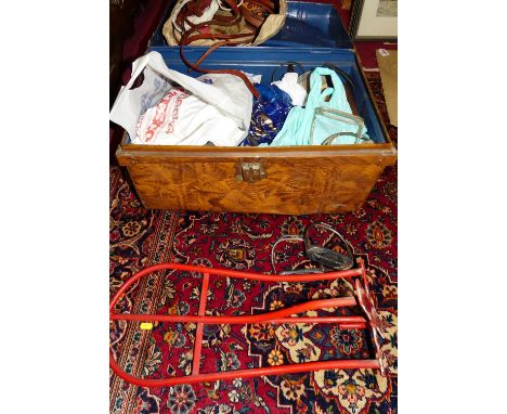 A metal trunk and contents of assorted saddlery tack, stirrups etc 