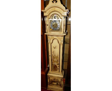 A contemporary cream painted long case clock, having arched brass and silvered dial titled Tempus Fugit, with three train mov