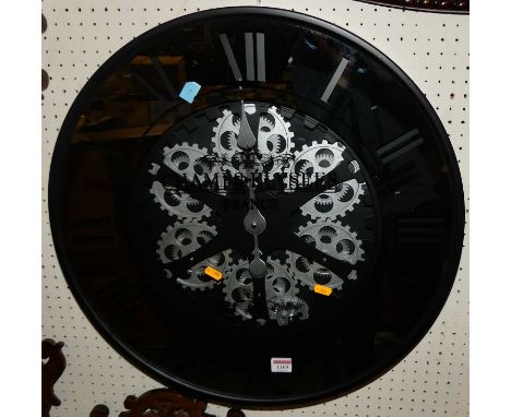 A contemporary black painted metal framed circular wall clock, titled 'Champs d'Elysses France', dia.59cm