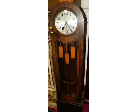 A 1930s oak long case clock, having a glazed trunk door, with three train movement (with pendulum but lacking weights), heigh