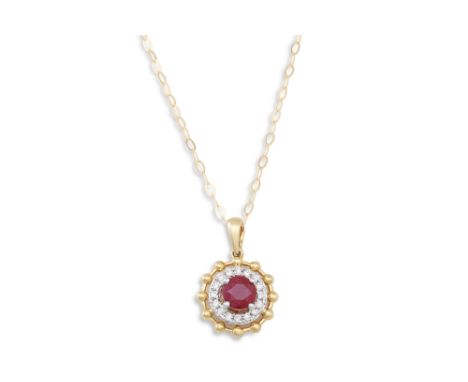 A DIAMOND AND RUBY PENDANT, on a chain