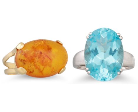 A TOPAZ RING, in 9ct gold, together with an 18ct gold amber ring. Size: N and R