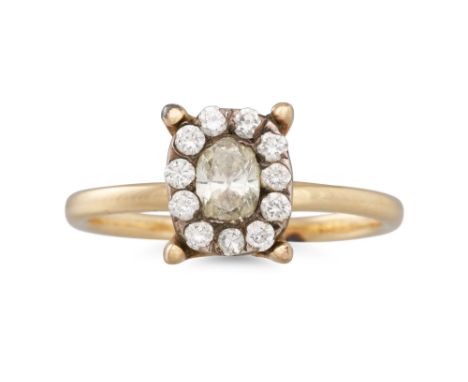 A DIAMOND CLUSTER RING, mounted in yellow gold. Estimated: weight of centre diamond: 0.50 ct. size L